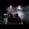 Photo du film Retour Vers le Futur on y voit la voiture Delorean portant une plque comme celle proposée sur cette page.CineProps Replica Reproduction objets de film.